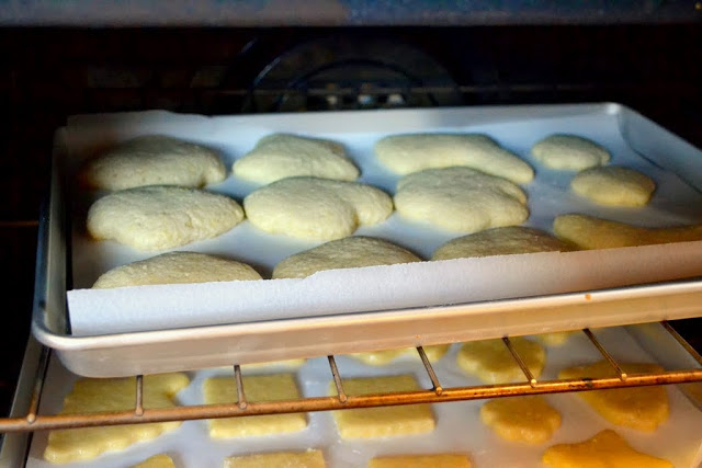 classic sugar cookie on piece of parchment paper and baking sheet (hard boiled egg cookies)