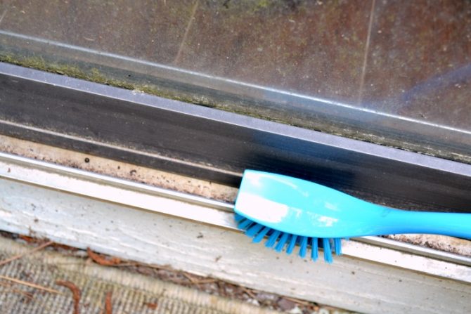 The Easiest Way to Clean Gunk Out of Your Sliding Door Track