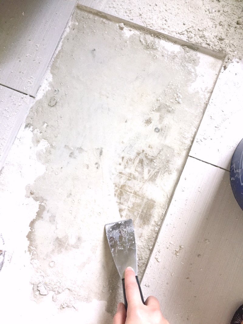 scraping wet tile adhesive from removed tile