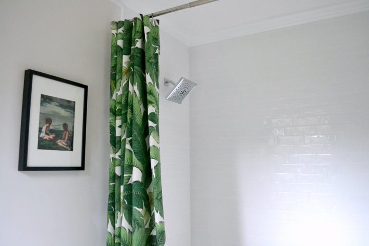 master bathroom shower renovation white subway tile green shower curtain