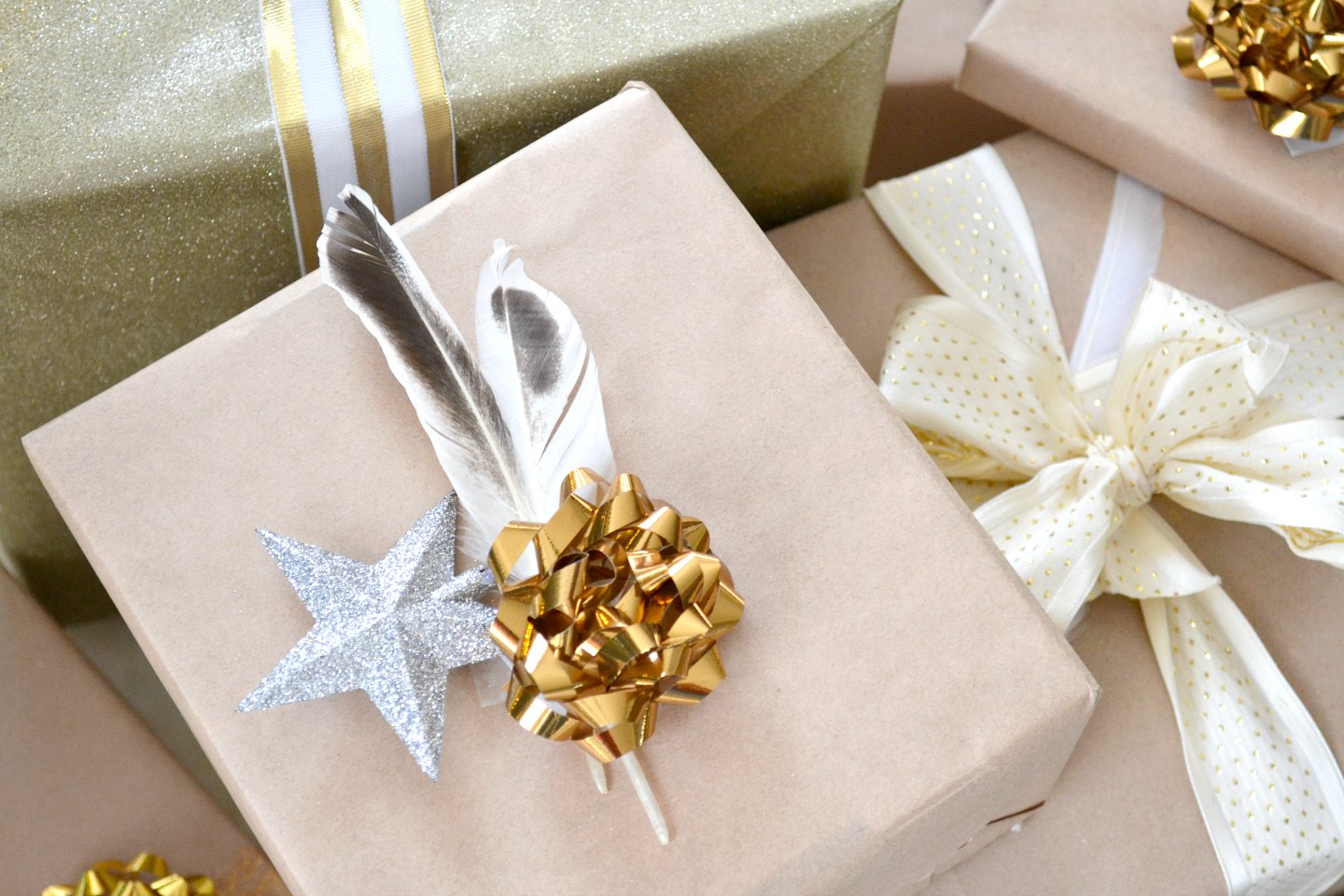 gold and neutrals - woodland theme gift wrapping with feathers