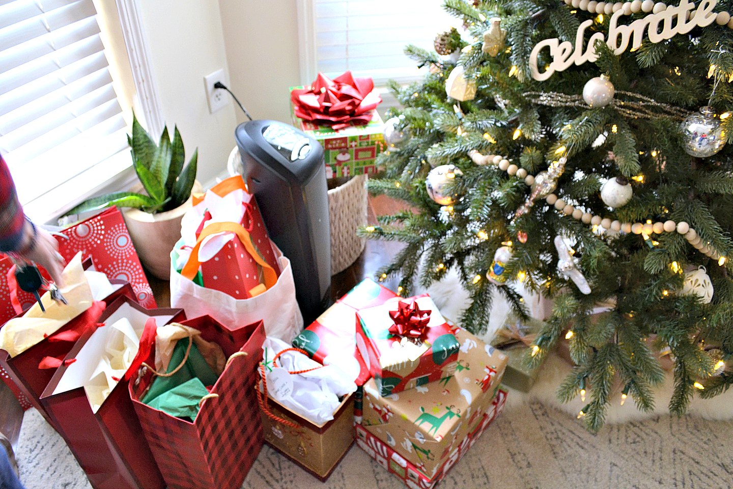 presents in a pile under the tree