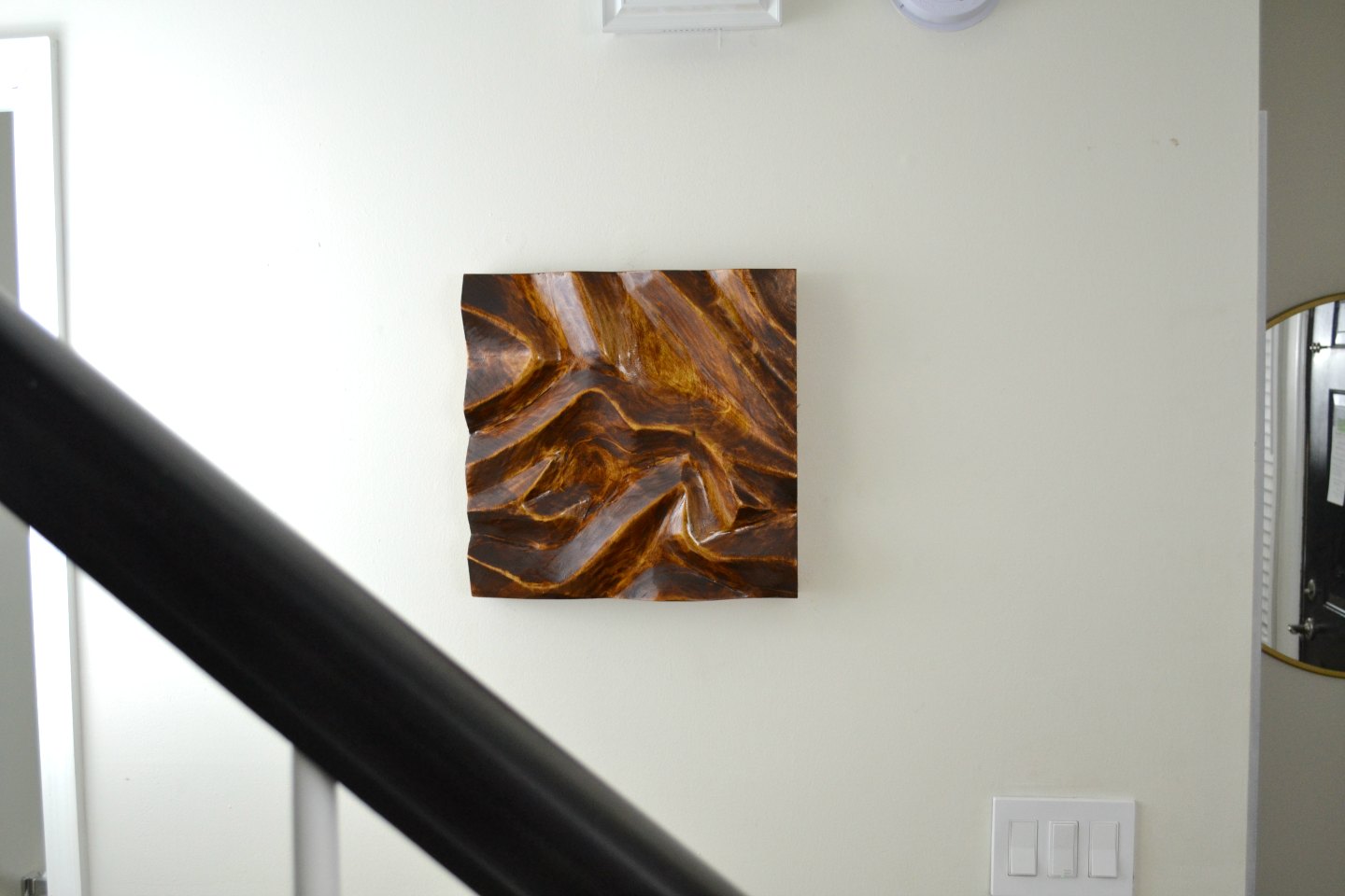 diy carved wood wall art in the entryway