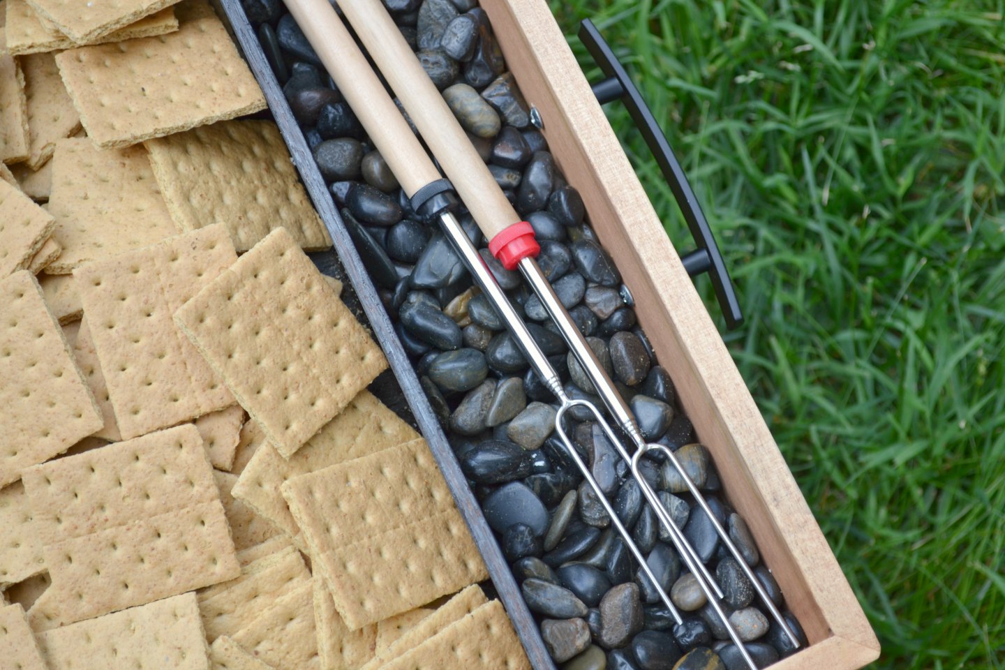 fill tray with rocks where roasting sticks will go