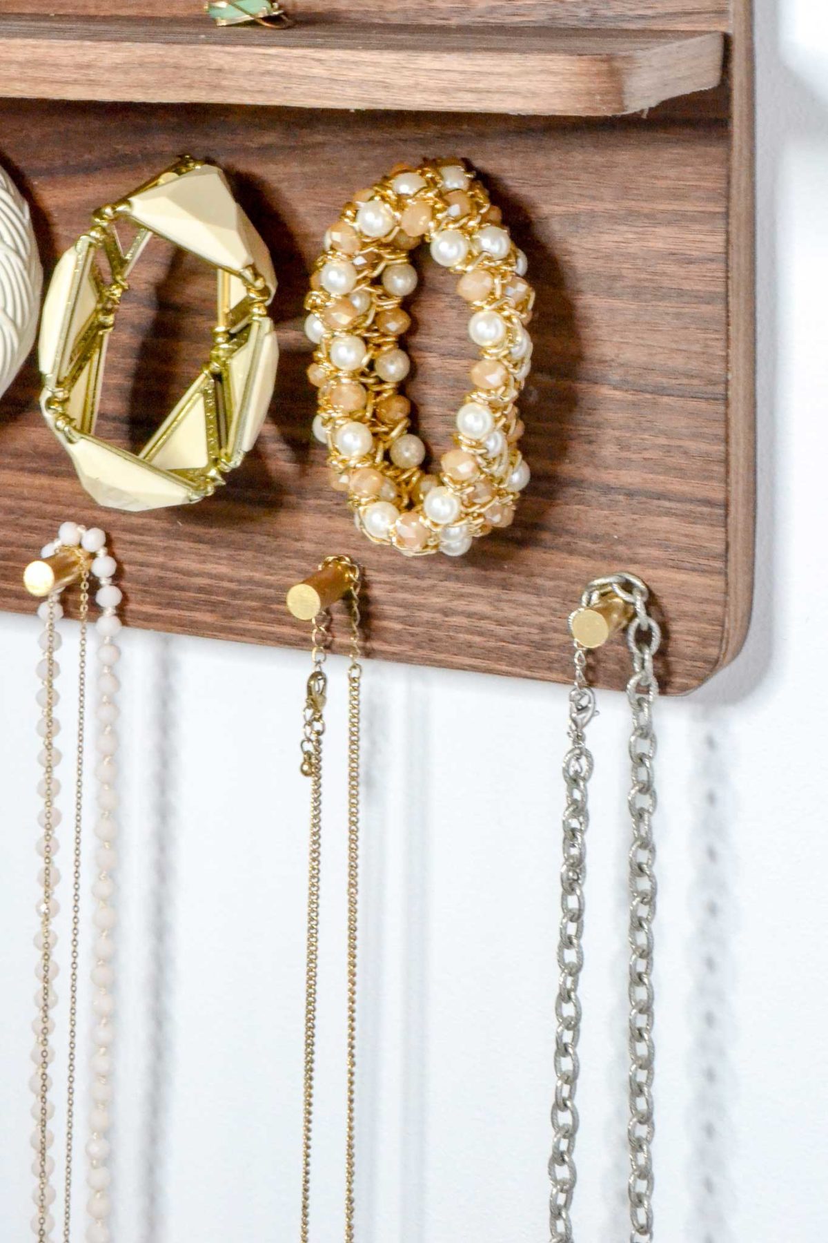 bracelets-and-necklaces-on-brass-rods
