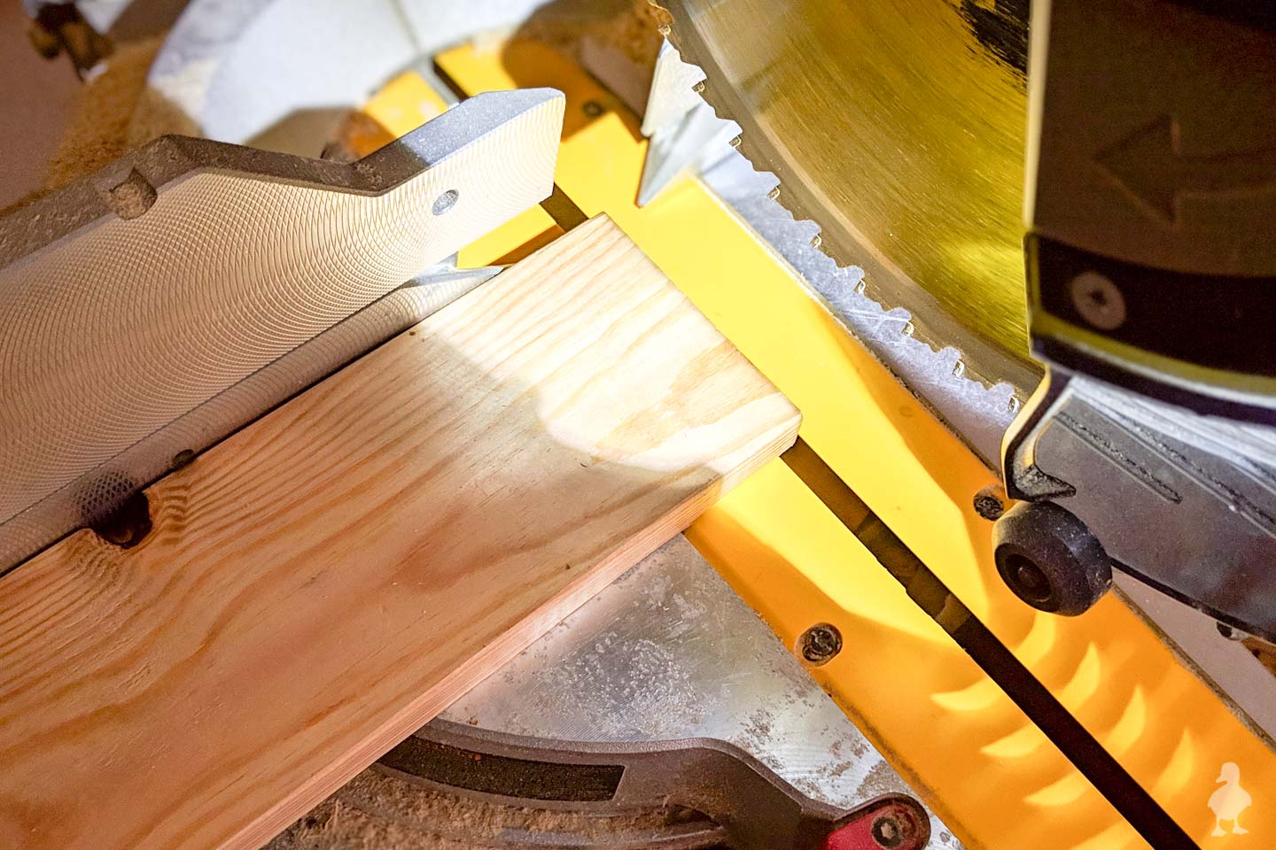 Cutting scrap wood to size using miter saw
