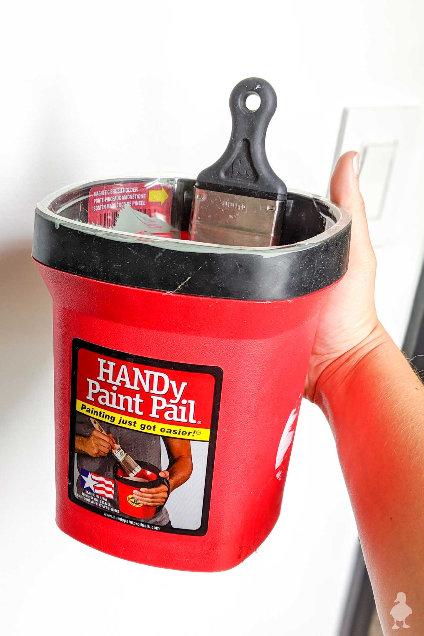 handy paint pail allows for better paint control up and down ladders