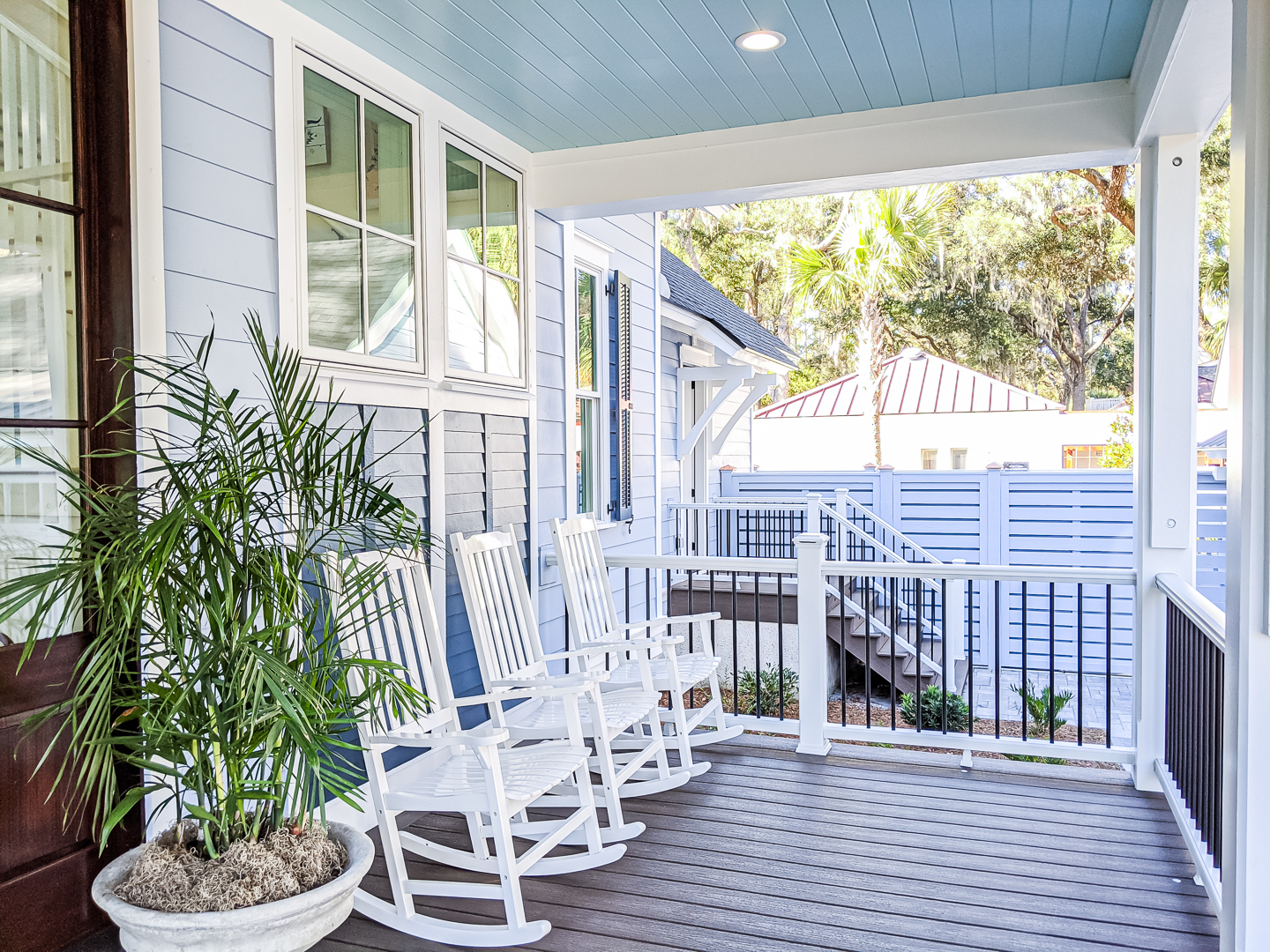 coastal southern front porch with haint blue ceiling