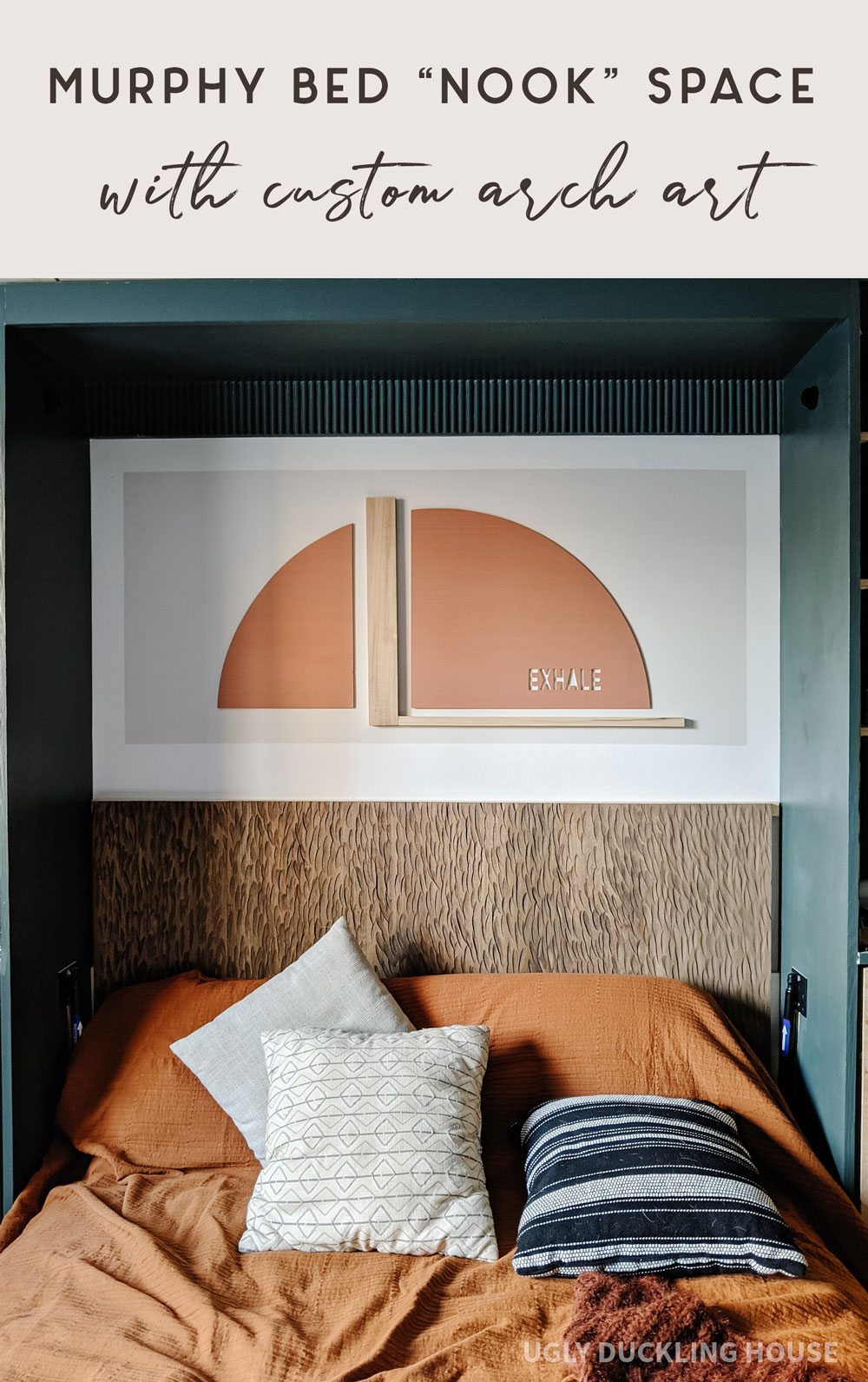 murphy bed nook space with custom arch art